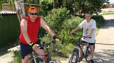 Teaching orphans how to ride a bike.