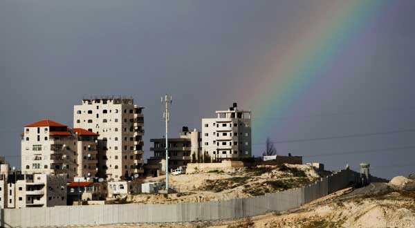 Reuters-Israel-barrier-refugee-camp-rainbow-photog-Ammar-Awad