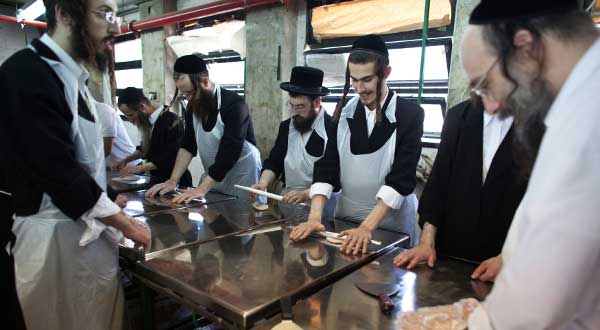 Ultra-Orthodox Jews Prepare Matza for Passover