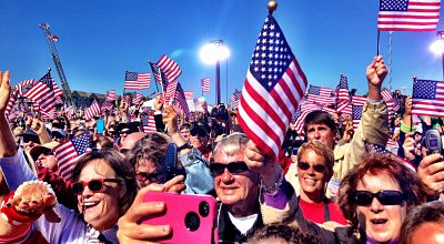 crowd with american flags