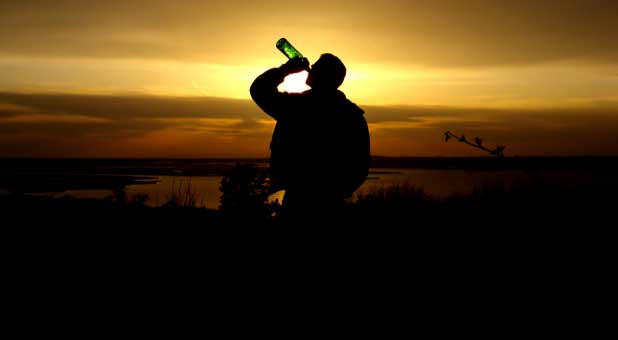 man drinking alcohol