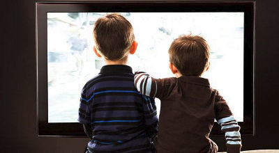 young boys watching television