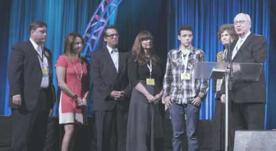 On Tuesday, George O. Wood (far right) accepted a second term as superintendent of the General Council of the Assemblies of God.