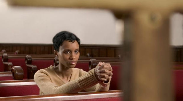 woman praying in church