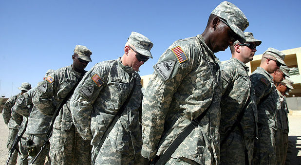 Army soldiers praying