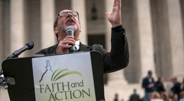 Patrick Mahoney prays outside Supreme Court