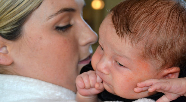 woman holding baby