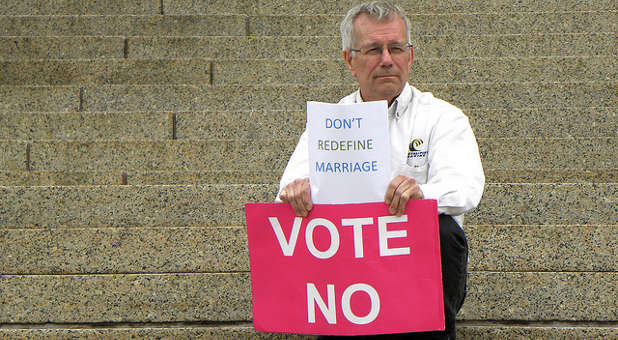 A man protests gay/redefining marriage in Minnesota.