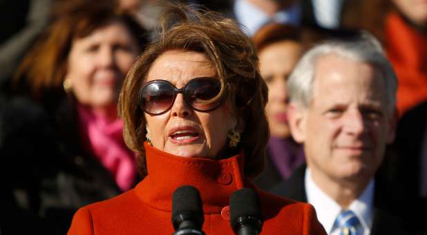 U.S. House Minority Leader Nancy Pelosi (D-CA), standing with fellow House Democrats.