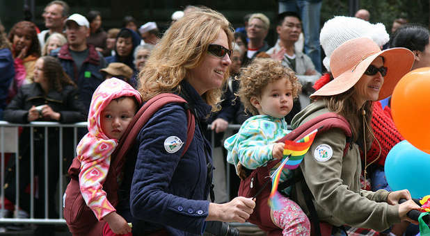 Gay parents with their children.