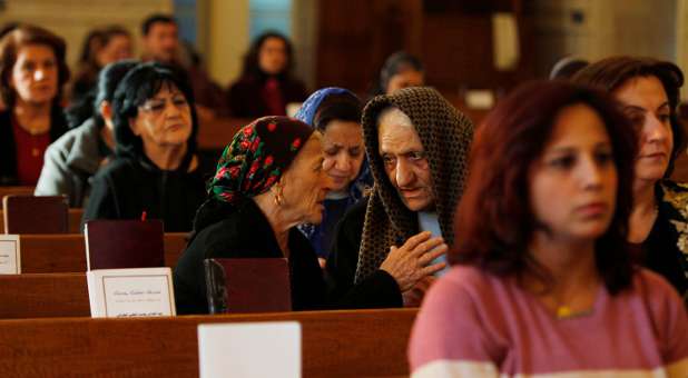 Iraqi Christians attend mass.