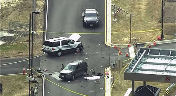 Federal law enforcement officials told Reuters that two people in a car tried to ram the spy agency's gate and initial indications are that at least one was seriously injured.