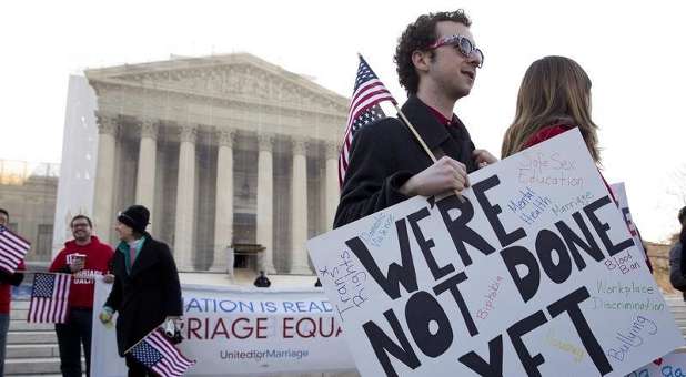 Supporters of gay marriage rally outside the Supreme Court House.