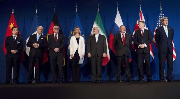 U.S. Secretary of State John Kerry (L) and Iranian Foreign Minister Javad Zarif (R) arrive to deliver statements after nuclear talks at the Swiss Federal Institute of Technology.