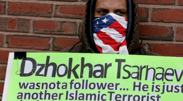 Jose Briceno of Cambridge, Massachusetts, holds a sign in front of the federal courthouse as the jury deliberates in the trial of Boston Marathon bombing suspect Dzhokhar Tsarnaev.