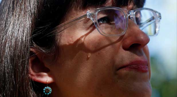 Kate Kelly of Ordain Women weeps during a vigil as members of the leadership of The Church of Jesus Christ of Latter-day Saints consider her excommunication from the church in Salt Lake City, Utah