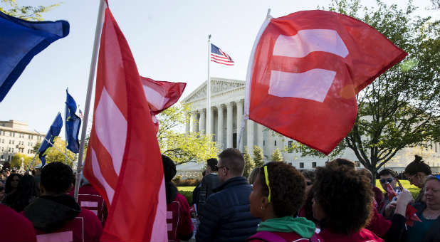 Gay marriage supporters gather around the Supreme Court.