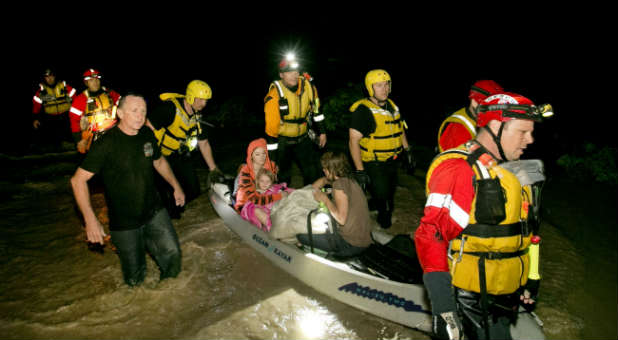 Rescue workers aid those affected by Texas flooding.