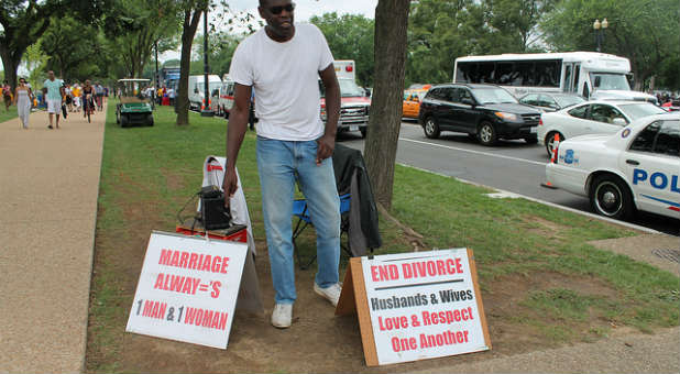 Pastors holding signs like these were brutally attacked at a Seattle pride event.