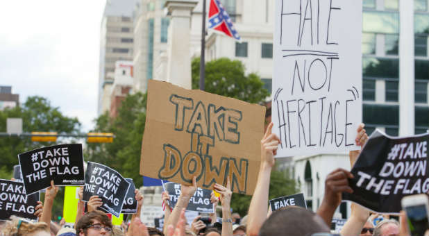 People gather to protest the Confederate flag.