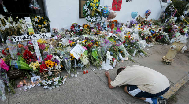 A man mourns at a memorial for the victims shot by Dylann Roof at the Emanuel AME Church in Charleston, South Carolina.