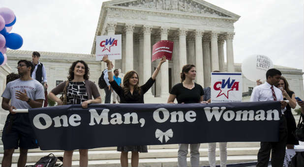 Demonstrators protest the Supreme Court ruling.