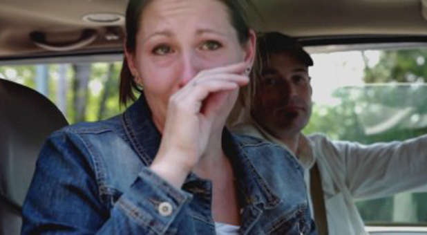 Melissa Klein (L) and husband Aaron are confronted by reporters in the wake of Oregon's judgment against them.