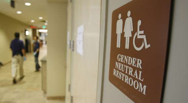 A gender-neutral restroom sign. Culture is pushing more and more for gender inclusion to appease a small group of people.