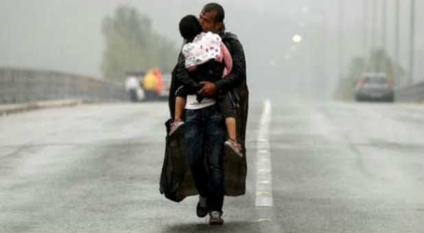 A Syrian migrant wanders through Europe with his son.