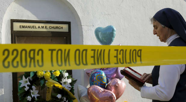 A nun at the memorial for Emanuel AME church.