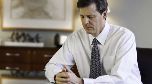 Businessman praying