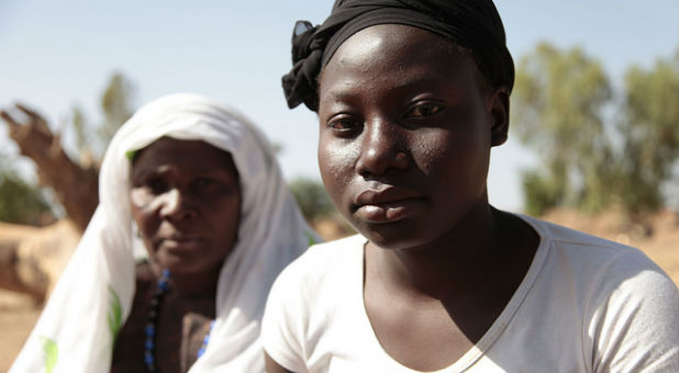 Esther, right, was 8-years-old when she was cut. She had to spend a month away from home while she recovered. She had little to eat and hated being separated from her mom.