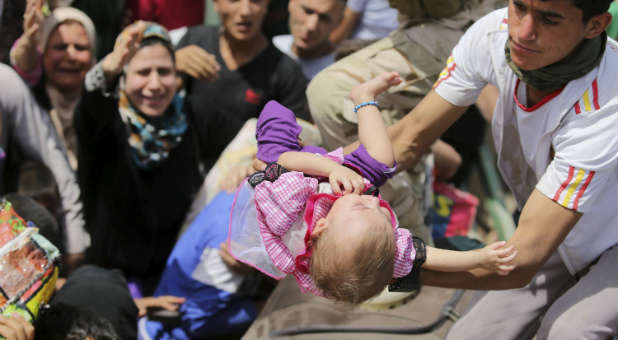 Refugees cross through Iraq.