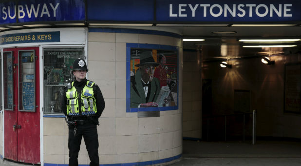 A security guard stands outside a London tube station after a recent terrorist attack.