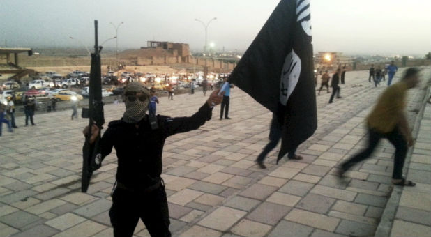 An Islamic State militant on the streets of Mosul.