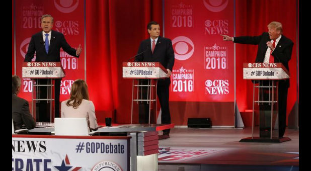 Republican U.S. presidential candidates Bush, left, and Trump, right, speak at the same time at the Republican U.S. presidential candidates debate sponsored by CBS News and the Republican National Committee in Greenville, South Carolina.