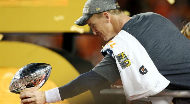 Peyton Manning's toasting to his wife, kids, God and beer after his big super bowl win.