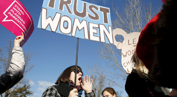 Abortion activists rally outside the Supreme Court.