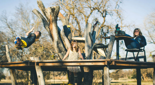 The Beam sisters playing, with Annabel center.