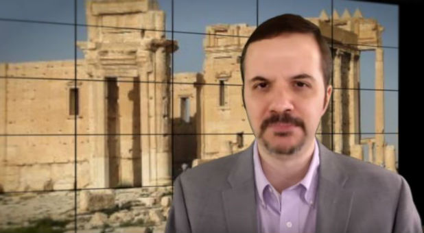 Michael Snyder in front of a depiction of the Temple of Baal