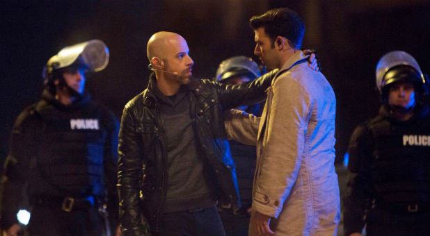 Chris Daughtry, left, as Judas, betrays Jencarlos Canela, right, as Jesus.