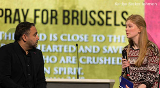 Liberty University sophomore Julia Young (right), a Belgian student, shares with Senior Vice President for Spiritual Development David Nasser and the Convocation crowd the story of how her parents survived a terror attack.