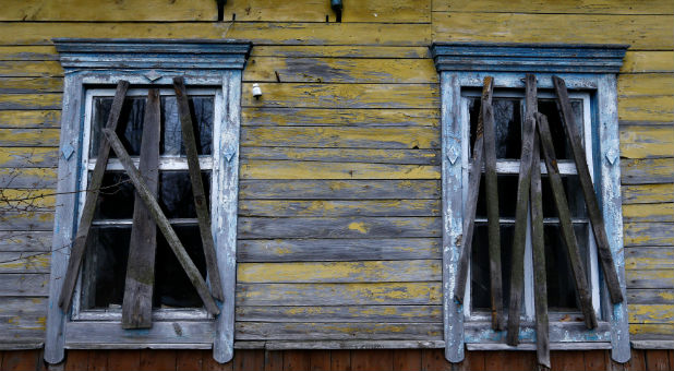 A new location for the Good Changes Church of God in Mariupol, Ukraine, is on the fringes of a war zone. A former Soviet Cultural Center, the building was used as a movie theater.