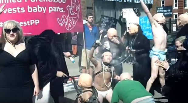 Satanists dressed as BDSM babies.