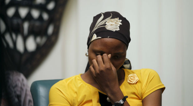 Rebecca Issac, a Chibok schoolgirl who had escaped from the Boko Haram, reacts during an event that marks the second anniversary of the Boko Haram abduction of Chibok schoolgirls.