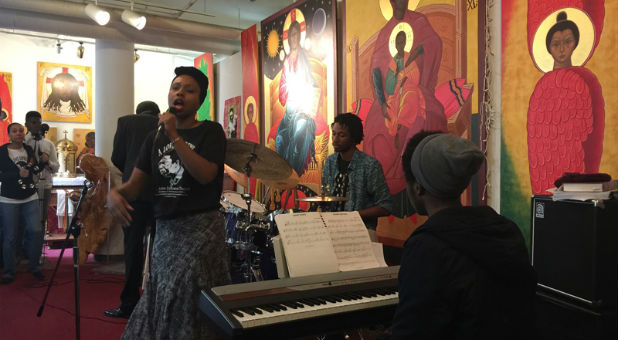 The Rev. Marlee-I Mystic sings vocals, left, while Landres King plays drums and Franzo King III plays the keyboard during the