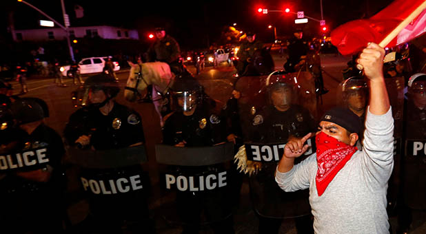 Protester and Riot Police