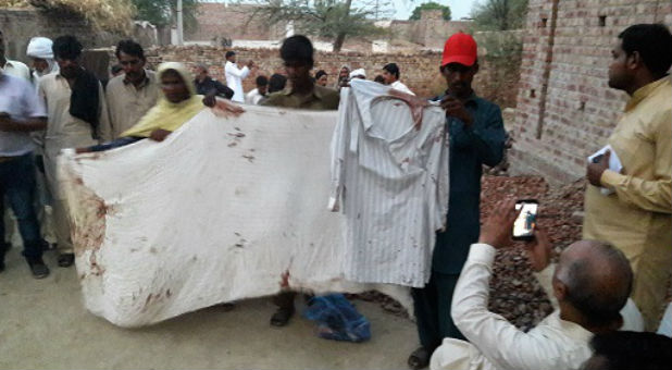 Bed sheet and clothes stained in blood following the attack on Jhoora Masih's house, June 2016