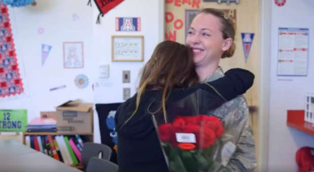 Neveah Thompson hugs her mother.