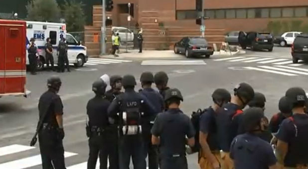 Police and first responders gather outside the University of California, Los Angeles, following a shooting.